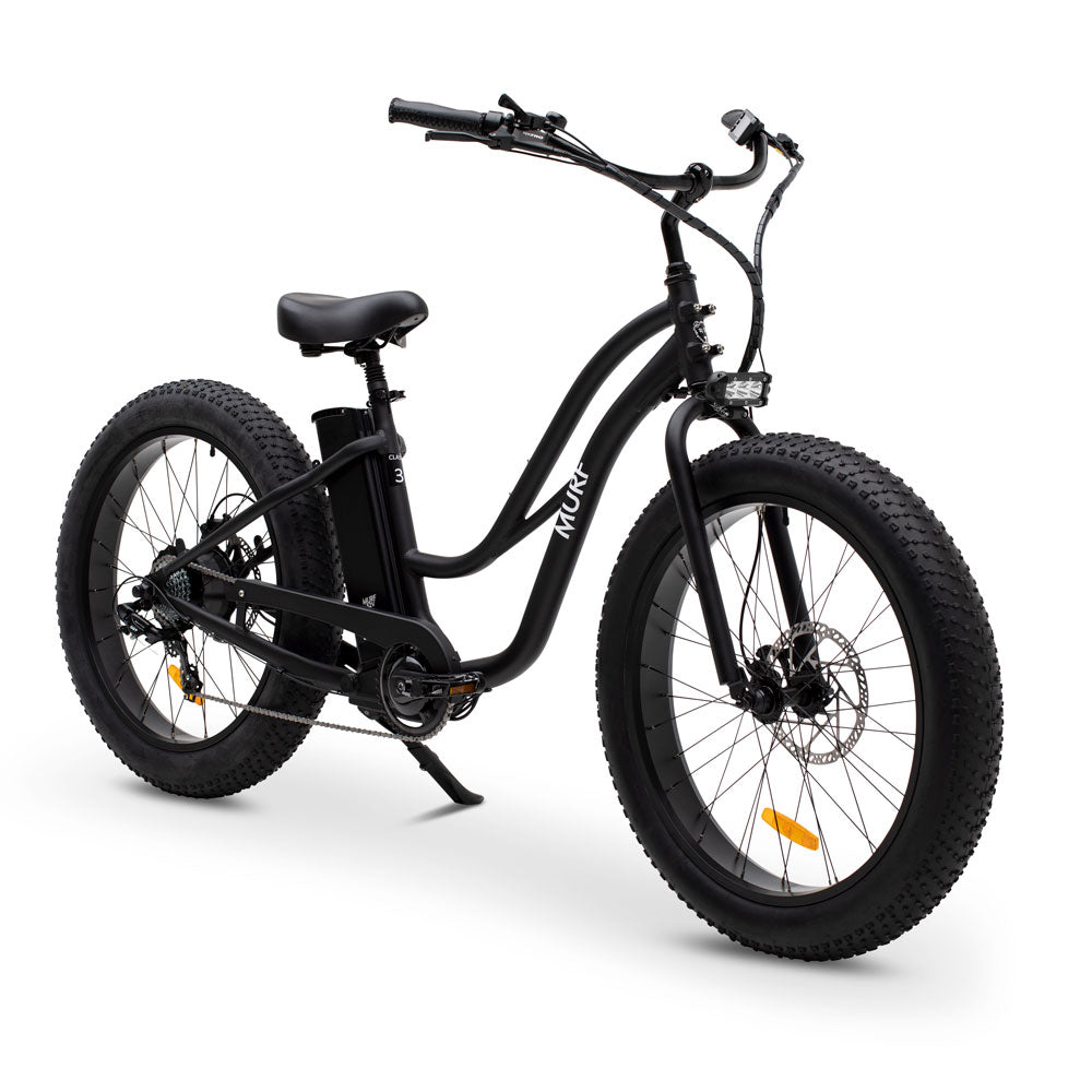 A step-through electric fat bike in black color with fat tires and a control screen on the handlebars.