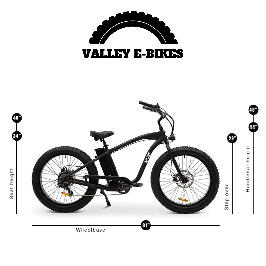 A fat tire electric beach cruiser bicycle with hydraulic disk brakes and a thumb throttle, mounted on large black tires and a classic beach cruiser frame.