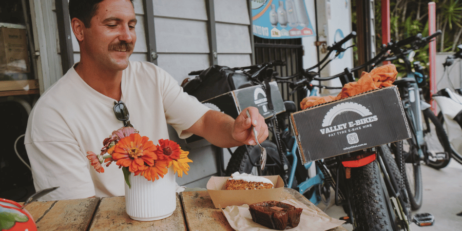 Rider enjoying a food stop at The Barn in Burringbar along the Northern Rivers Rail Trail